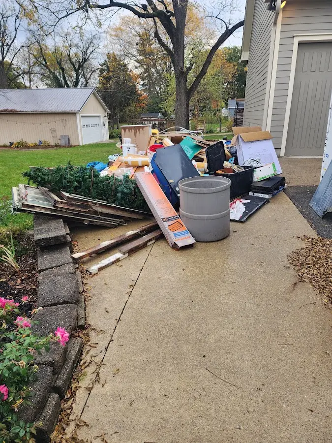 Dumpster being loaded with debris for Commercial Dumpster Rental in Verona